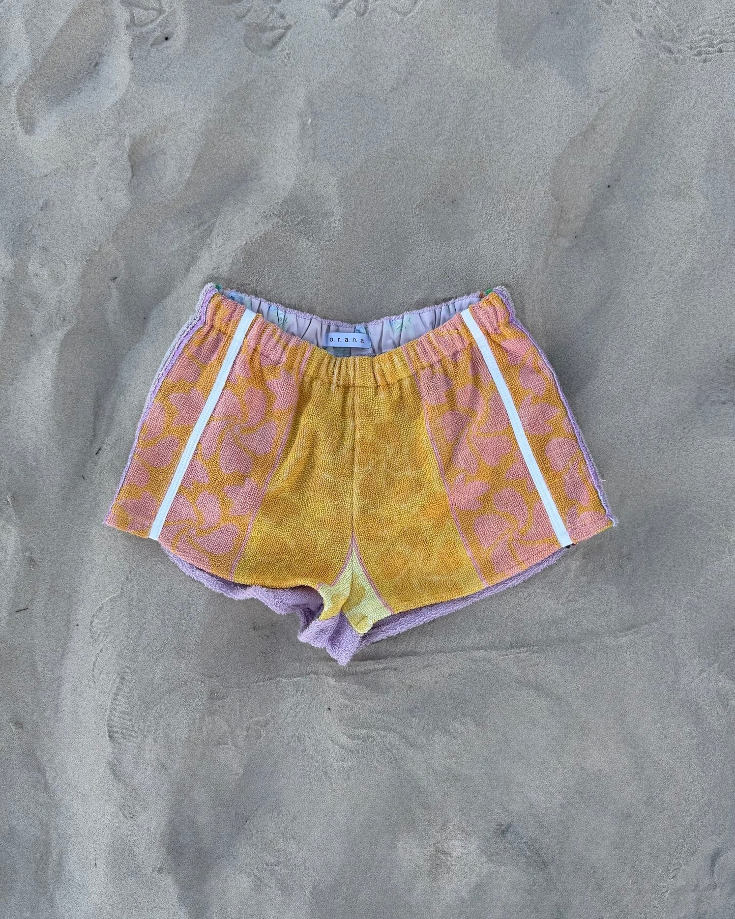 Orana redefining upcycling — one-of-a-kind reworked shorts, handmade in Byron Bay, Australia, from reclaimed vintage towels and textiles, inspired by nostalgic summer holiday memories, for a conscious and sustainable future
