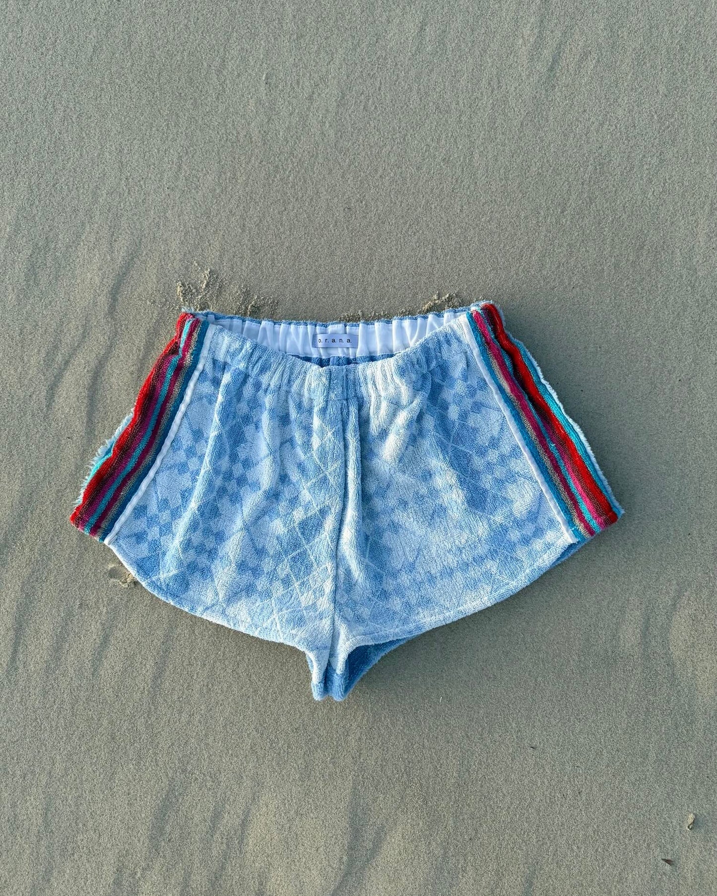 Orana redefining upcycling — one-of-a-kind reworked shorts, handmade in Byron Bay, Australia, from reclaimed vintage towels and textiles, inspired by nostalgic summer holiday memories, for a conscious and sustainable future
