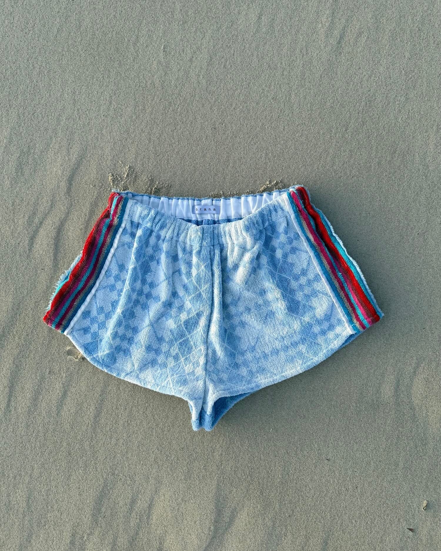 Orana redefining upcycling — one-of-a-kind reworked shorts, handmade in Byron Bay, Australia, from reclaimed vintage towels and textiles, inspired by nostalgic summer holiday memories, for a conscious and sustainable future
