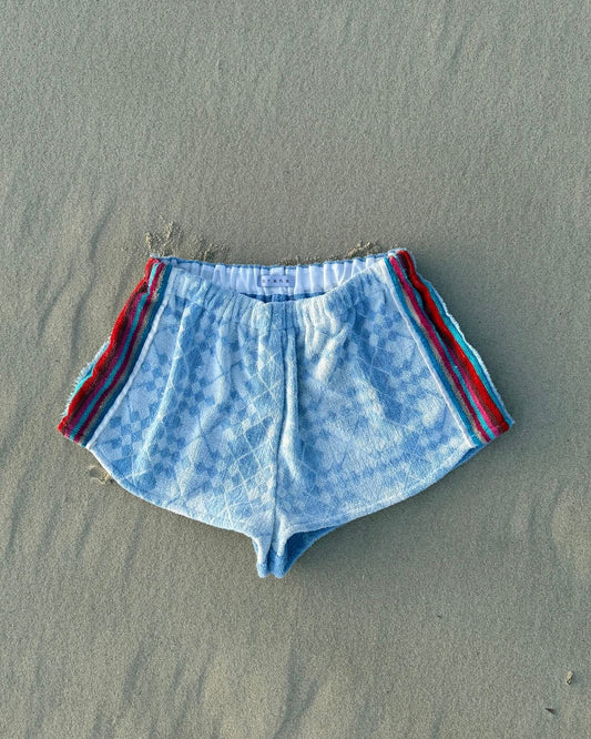 Orana redefining upcycling — one-of-a-kind reworked shorts, handmade in Byron Bay, Australia, from reclaimed vintage towels and textiles, inspired by nostalgic summer holiday memories, for a conscious and sustainable future
