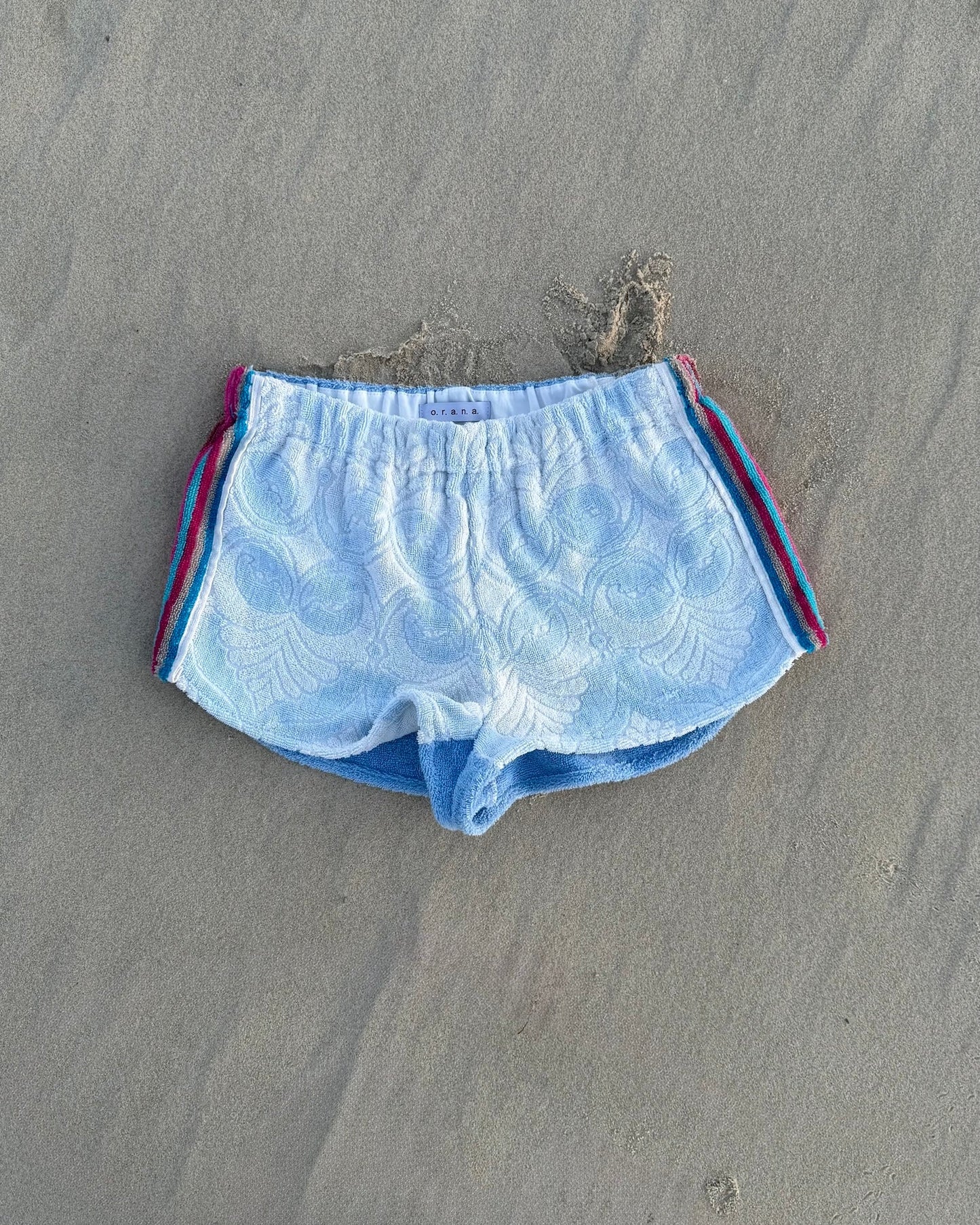 Orana redefining upcycling — one-of-a-kind reworked shorts, handmade in Byron Bay, Australia, from reclaimed vintage towels and textiles, inspired by nostalgic summer holiday memories, for a conscious and sustainable future
